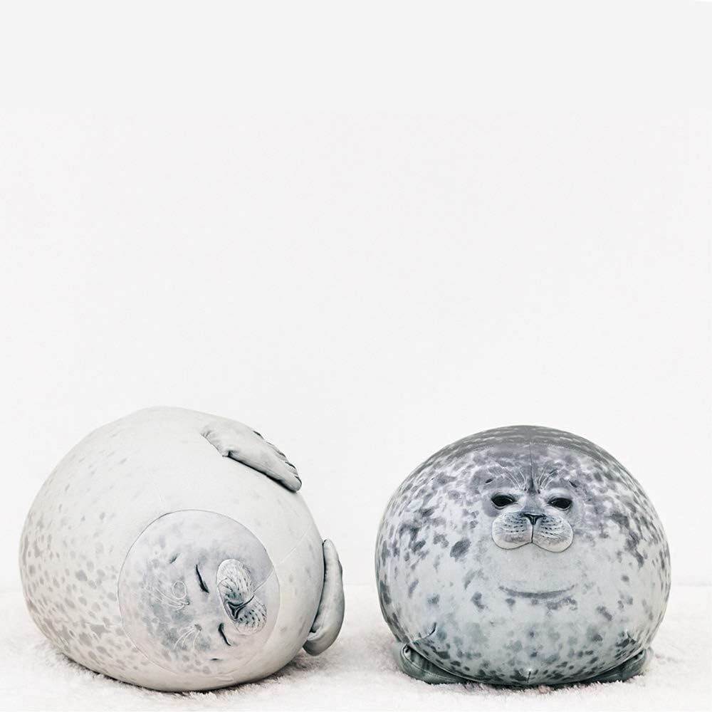 Chubby seal plush pillow, made of cotton and plush material.